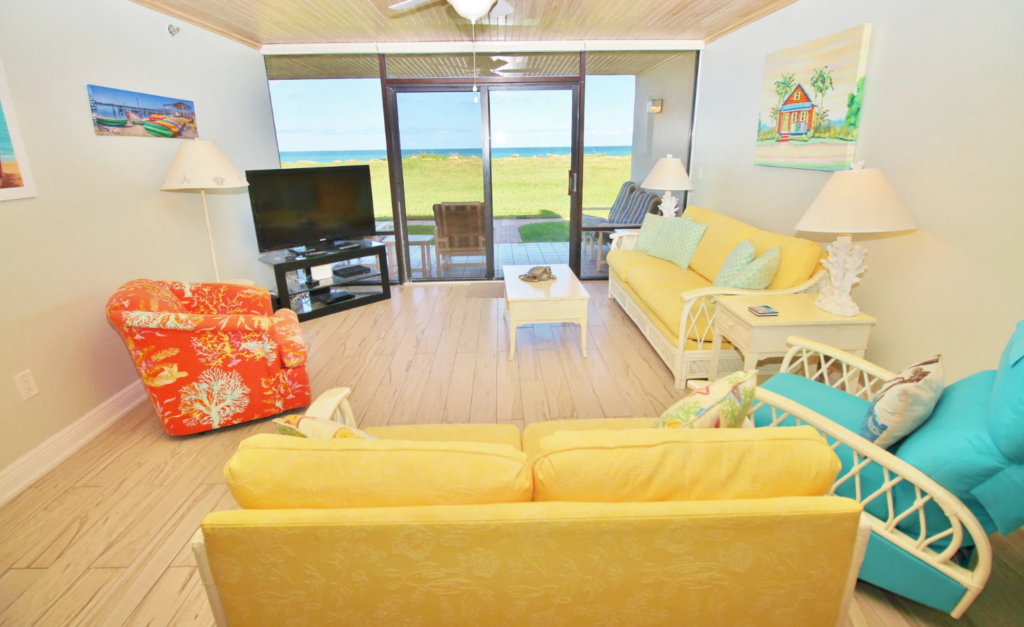 Interior of condo, view of ocean, bright interior.